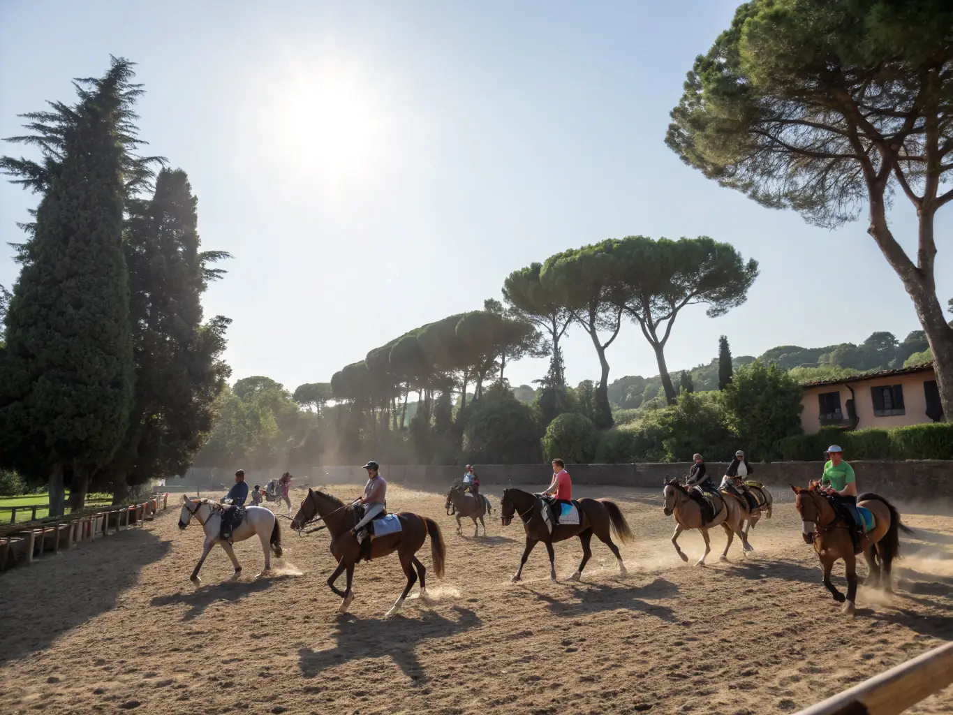 A group of riders of various ages and skill levels participating in a training session at ECURIE DES PINS, with a focus on skill development and technique refinement.